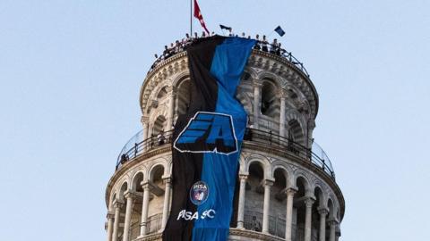 Pisa banner on the Leaning Tower of Pisa