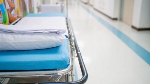 A hospital bed in a corridor