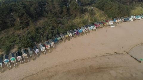 A row of colourful beach huts at Wells-next-the-Sea.