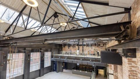 Interior of old industrial building with modern lightening and skylights