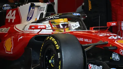 Ferrari's Lewis Hamilton leaving the pits before the British Grand Prix sprint race
