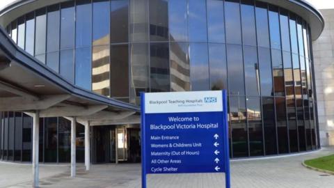Front entrance of Blackpool Victoria Hospital showing the sign which reads: 'Welcome to Blackpool Victoria Hospital'.