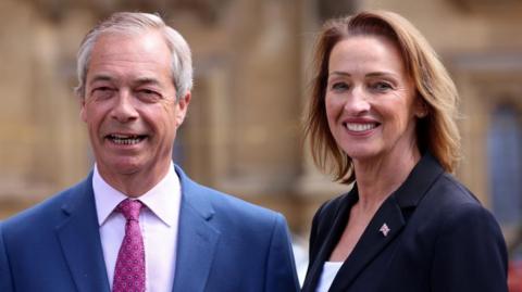 Nigel Farage and Sarah Pochin outside Parliament in May 2025