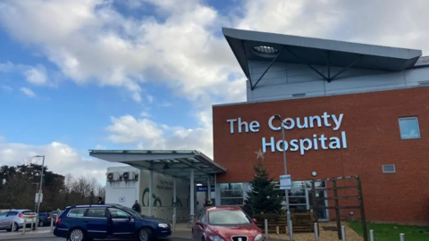 General view of the entrance and car park of Hereford County Hospital