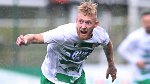 Brad Young celebrates scoring goal for TNS