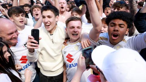 Joe Tomlinson of Milton Keynes Dons celebrates their side's promotion to EFL League One