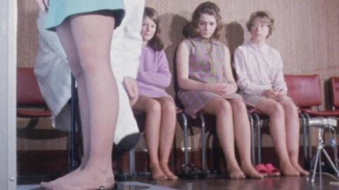 Women sitting with bare legs.