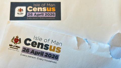 A letter and envelope with the Isle of Man census logo and date on them.