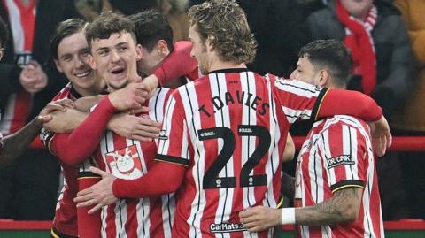 Sheffield United players celebrate with goalscorer Harrison Burrows