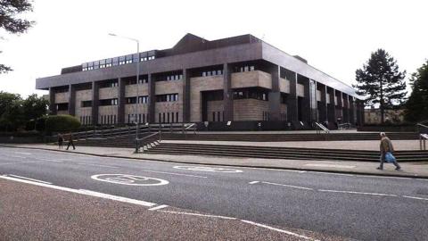 Glasgow Sheriff Court, a brutalist concrete building.