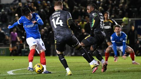 Portsmouth's Yang Min-hyeok scores in the 98th-minute against Charlton as Sonny Carey and Amari'i Bell try to block the goalbound shot