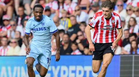 Stoke City's Eric Bocat put under pressure by Southampton's Tom Fellows during their Championship match on Saturday