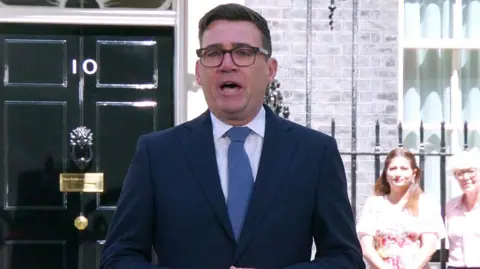 Burnham outside no 10
