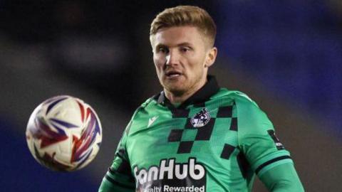 Taylor Moore watches the ball in action for Bristol Rovers against his old club Shrewsbury Town in March 2025.