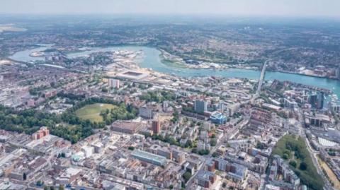 Aerial view of Southampton city with a winding river at the top of the image.
