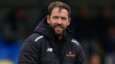 Worthing manager Chris Agutter smiling