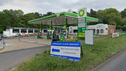 A Google Maps picture of the BP garage in Bracknell, a garage forecourt with a sign that says: "Unique car wash. Best hand car wash in Berkshire!" 