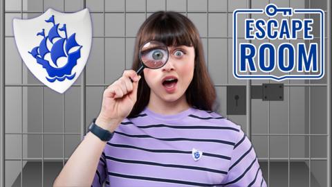 Blue Peter Abby holds up a magnifying glass, she is in an escape room.