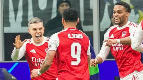 Arsenal celebrate in the Champions League