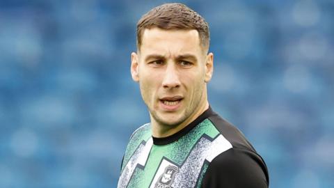 Marko Marosi warms up for Plymouth Argyle