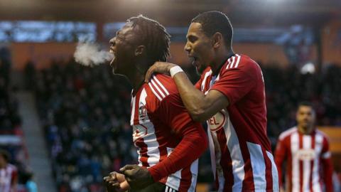 Vincent Harper celebrates after taking Exeter City 3-1 up against Oxford United