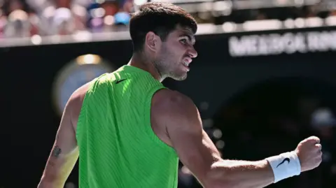 Carlos Alcaraz celebrates a point