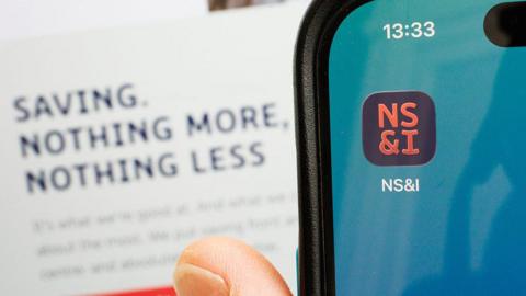 Close up of a phone with the NS&I app