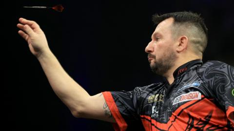 Jonny Clayton throws a dart