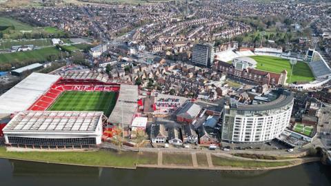 Aerial image with the River Trent in the foreground, with the City Ground and Trent Bridge Cricket Ground behind