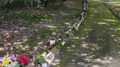 Memorial gardens close up photo of plaques and flowers