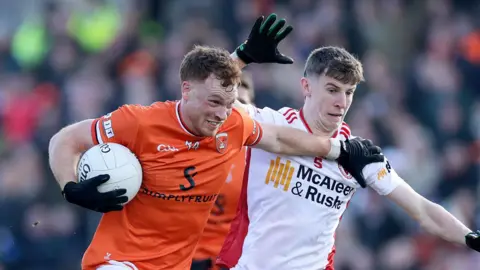 Armagh's Jason Duffy and Ciarán Bogue of Tyrone
