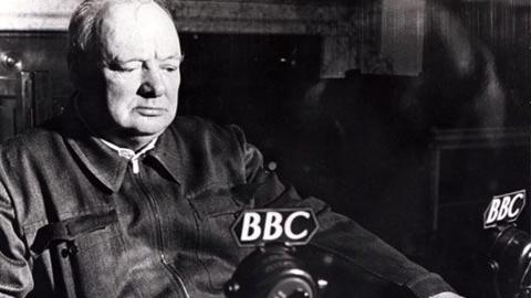 Winston Churchill sits in front of a 鶹ҳ microphone