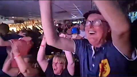 Football fans celebrate.