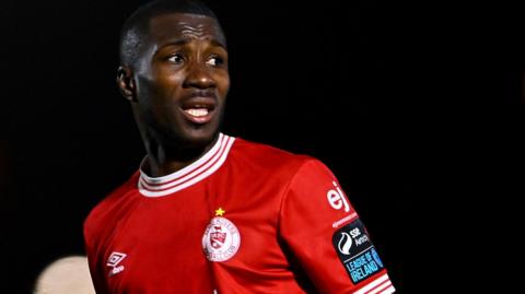 Mai Traore in action for Sligo Rovers in their red home shirt