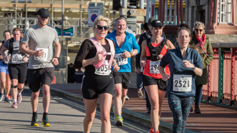 Runners on the seafront during the Weymouth Half