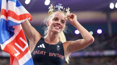 Keely Hodgkinson poses with a crown and union flag after winning 800m Olympic gold at Paris 2024