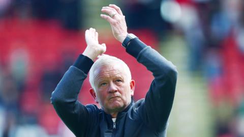 Sheffield United boss Chris Wilder applauding the fans post-match.