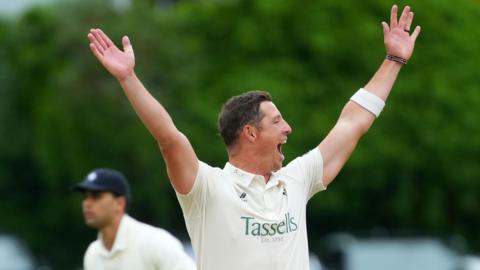 Kent's Keith Dudgeon, in whites, appeals to the right of shot, to an unpictured umpire
