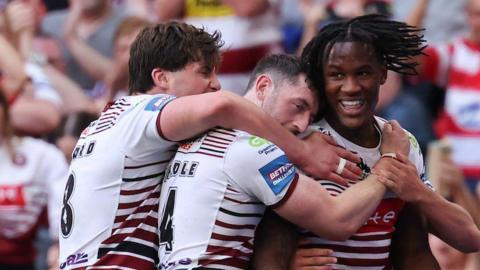 Junior Nsemba of Wigan Warriors celebrates a try