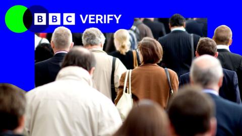 A photo of a crowd of people walking away from the camera. The BBC Verify colours are visible in the background of the image