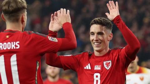 Harry Wilson (R) celebrates