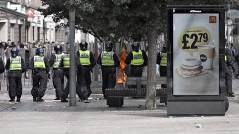 Police officers form a line during the 2024 Hull riots