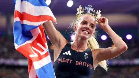 Great Britain's Keely Hodgkinson celebrates with Union Flag and a crown after winning Olympic 800m gold at Paris 2024