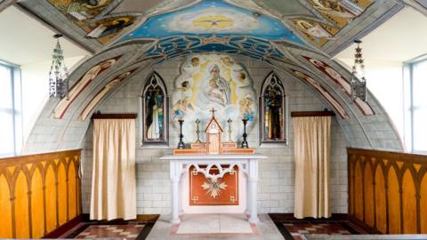 The ornate altar of Italian Chapel on Lamb Holm in Orkney, Scotland, UK