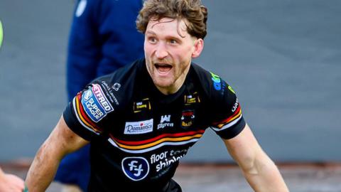 Ethan Ryan celebrates scoring a try for Bradford Bulls
