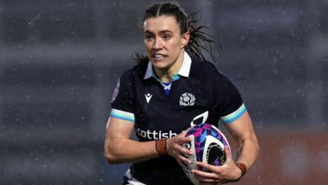 Francesca McGhie carries the ball for Scotland