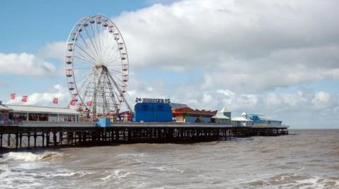Central Pier in Blackpool, a pier with a theme park on and a big wheel.