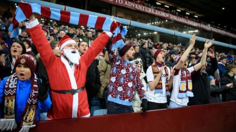 Aston Villa fans attend a game at Christmas