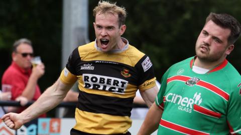 Carwyn Penny of Newport celebrates after scoring one of Newport's tries at Ebbw Vale