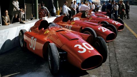 Four Ferrari cars are pictured in a row before the 1956 Italian Grand Prix